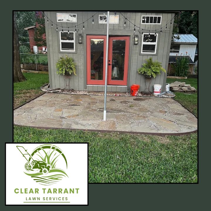 Flagstone patio installed by Clear Tarrant beside a backyard studio in Arlington, TX